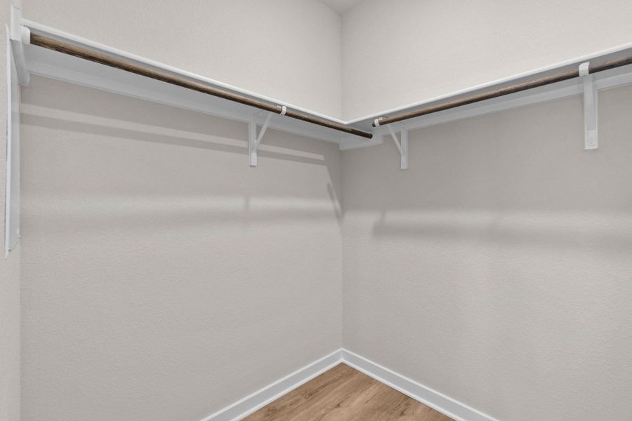 Walk-in closet in Primary Bedroom Walk-in closet in Primary Bedroom