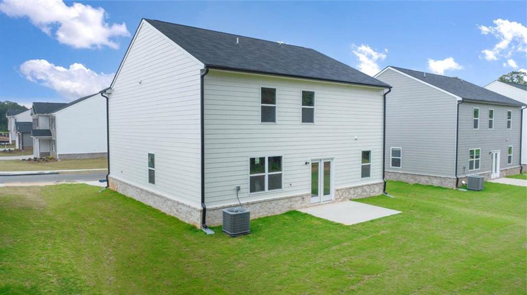 Exterior details and patio area of a home in The Reserve at Calcutta, Stockbridge (Image 4).