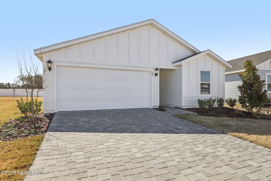 Front exterior of a new home in Colbert Landings, Palm Coast, FL, highlighting curb appeal (Image 22).