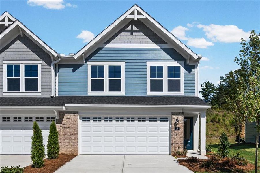 Front exterior of a new home in Villas at Gold Creek, Dawsonville, GA, highlighting curb appeal (Image 1). Front exterior of a new home in Villas at Gold Creek, Dawsonville, GA, highlighting curb appeal (Image 1).