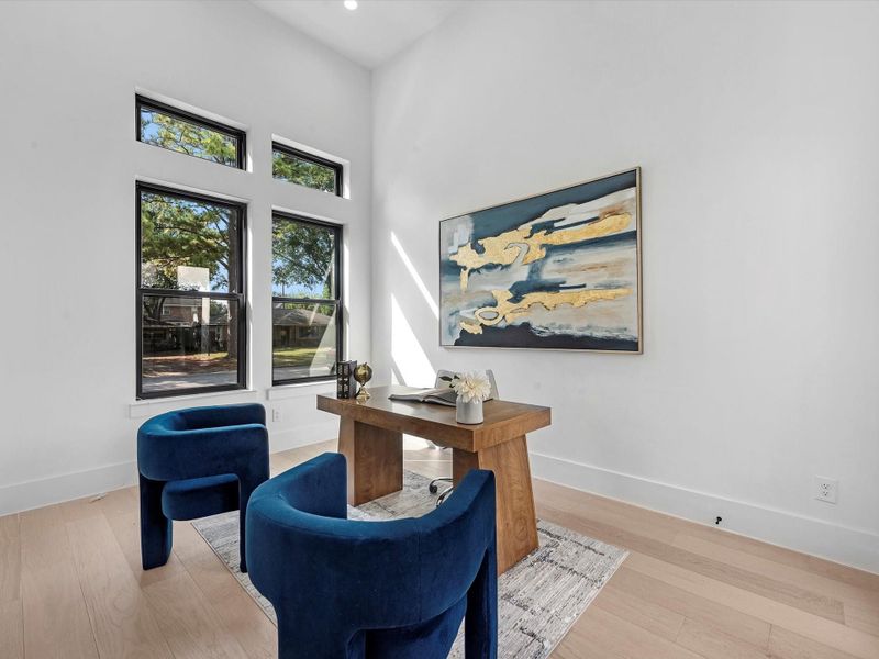 A private home office with elegant French doors that open directly to your serene courtyard retreat.