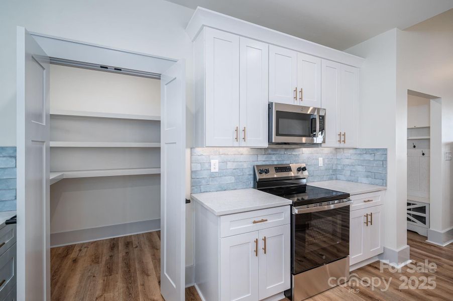 Furnished interior view inside a new home in , Vale (Image 11).