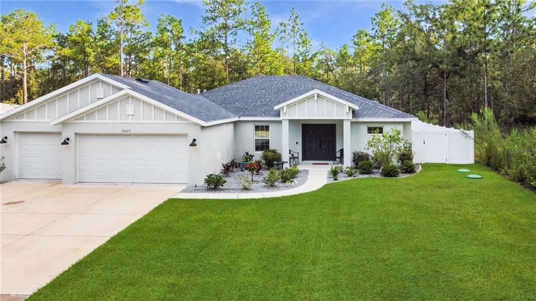 Front exterior of a new home in , Weeki Wachee, FL, highlighting curb appeal (Image 22).