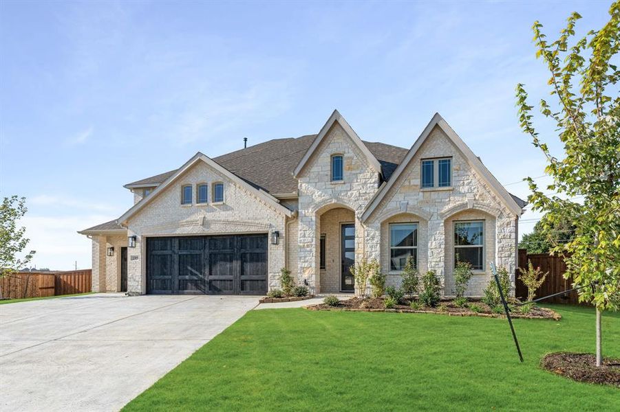 Front exterior of a new home in Rockwood 90, Mansfield, TX, highlighting curb appeal (Image 27). Front exterior of a new home in Rockwood 90, Mansfield, TX, highlighting curb appeal (Image 27).