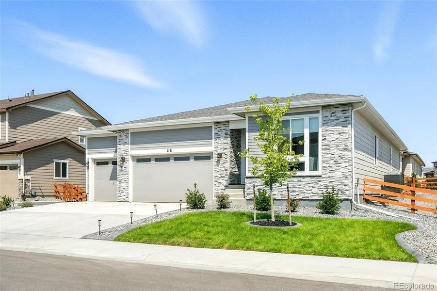 Front exterior of a new home in Creekside Village, Thornton, CO, highlighting curb appeal (Image 23).