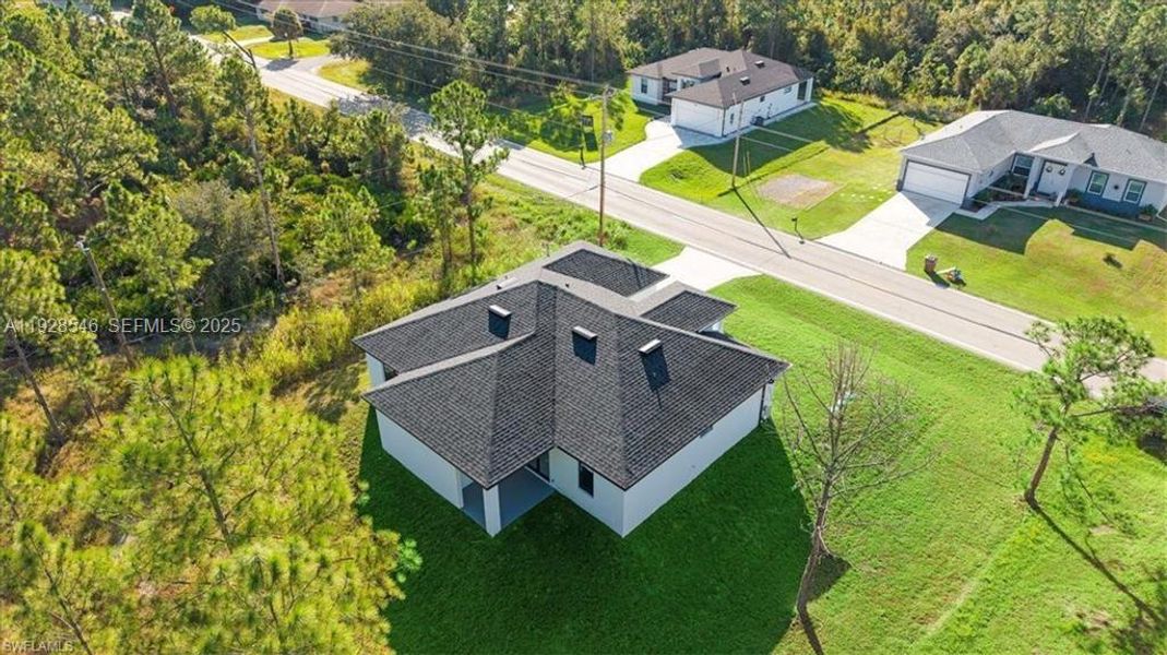 Front exterior of a new home in , Lehigh Acres, FL, highlighting curb appeal (Image 22).