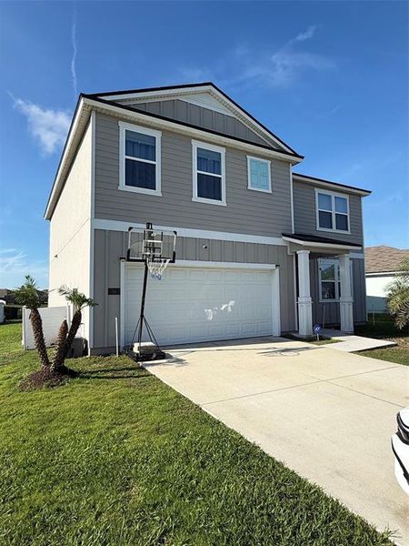 Front exterior of a new home in , Palm Coast, FL, highlighting curb appeal (Image 23).