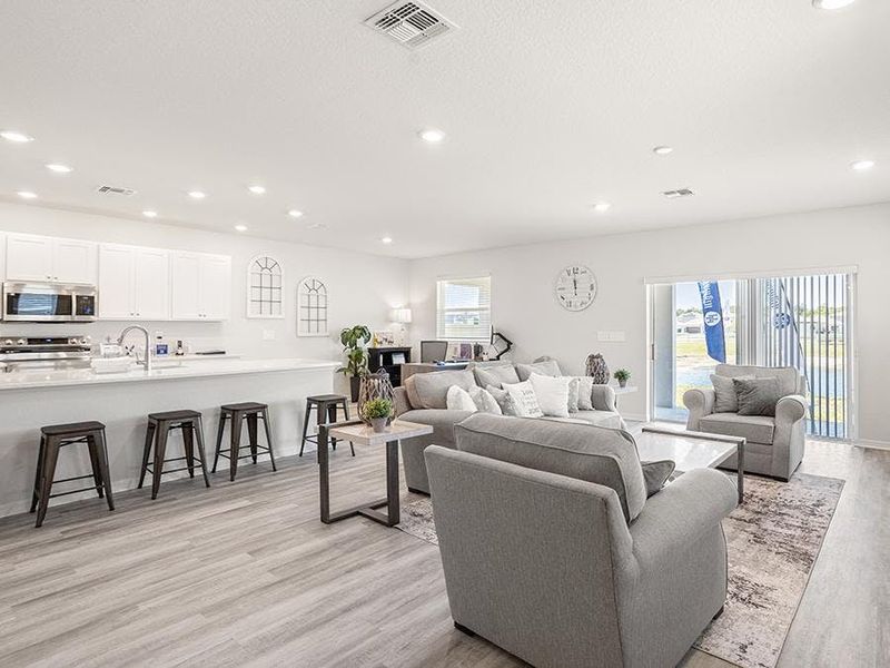 Enjoy a sunny, open living area with LVP flooring. Enjoy a sunny, open living area with LVP flooring.
