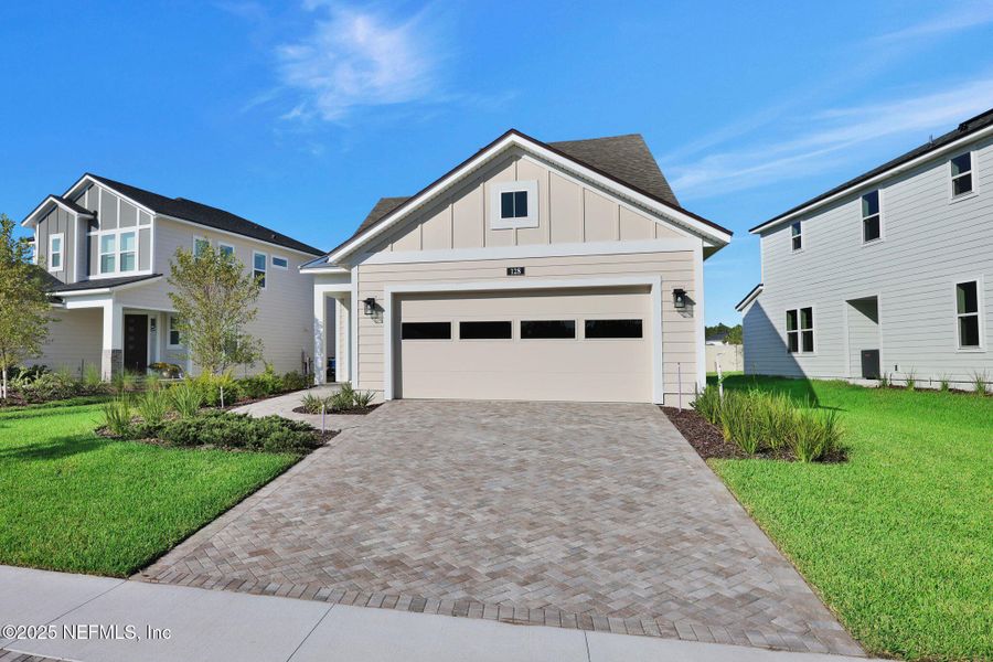 Front exterior of a new home in Crosswinds at Nocatee, Ponte Vedra Beach, FL, highlighting curb appeal (Image 26). Front exterior of a new home in Crosswinds at Nocatee, Ponte Vedra Beach, FL, highlighting curb appeal (Image 26).
