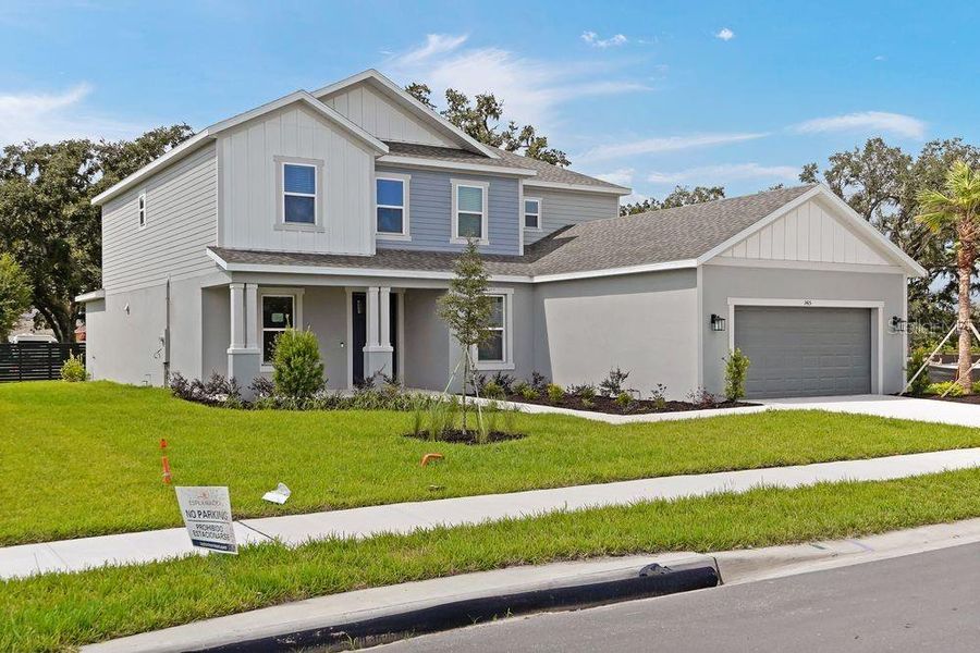 Front exterior of a new home in Timber Ridge, Plant City, FL, highlighting curb appeal (Image 2).