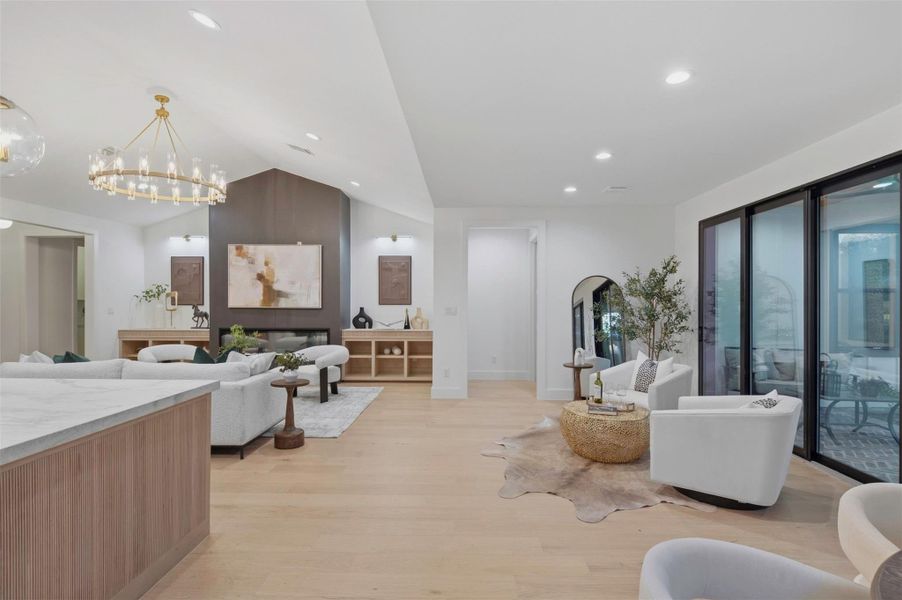Dramatic corner windows create a seamless indoor-outdoor feel in the dining space, offering expansive backyard views and a bright, airy setting for entertaining.