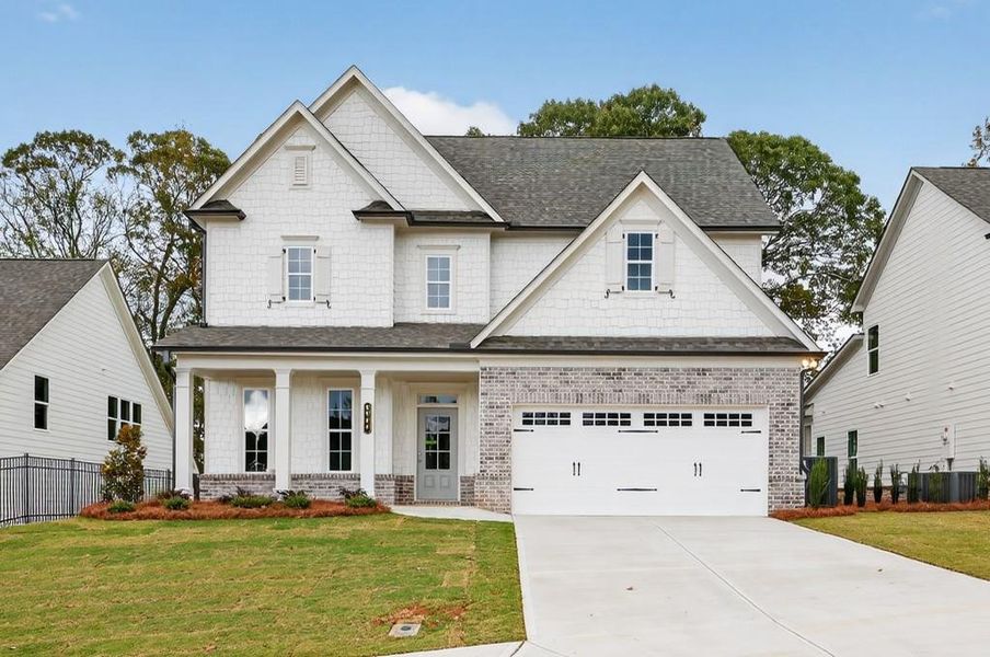 Front exterior of a new home in Hemingway, Flowery Branch, GA, highlighting curb appeal (Image 1).
