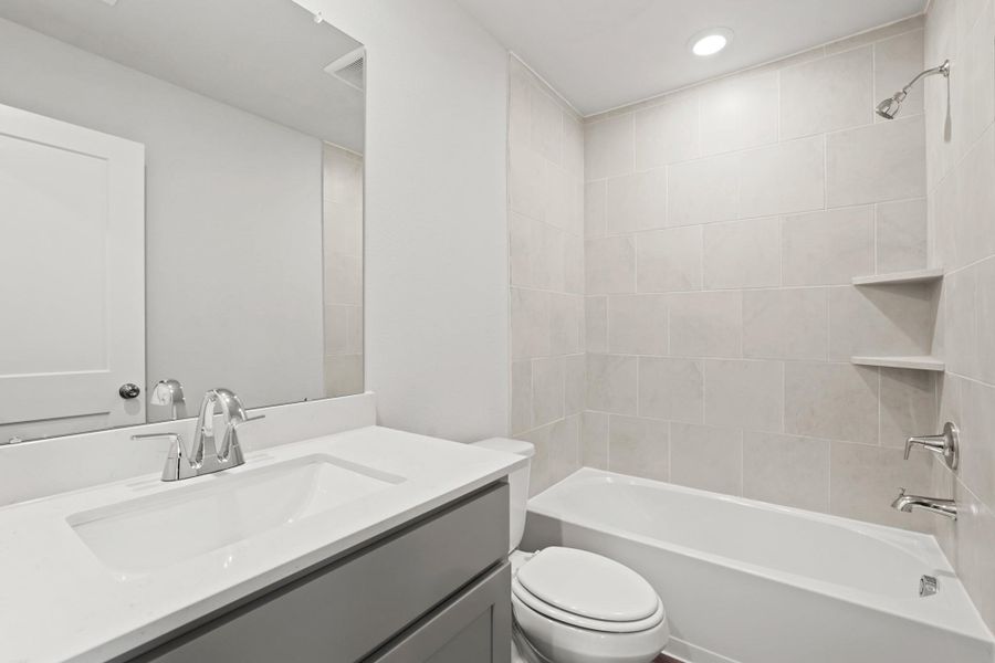 Furnished interior view inside a new home in Woodshore, Clute (Image 7).