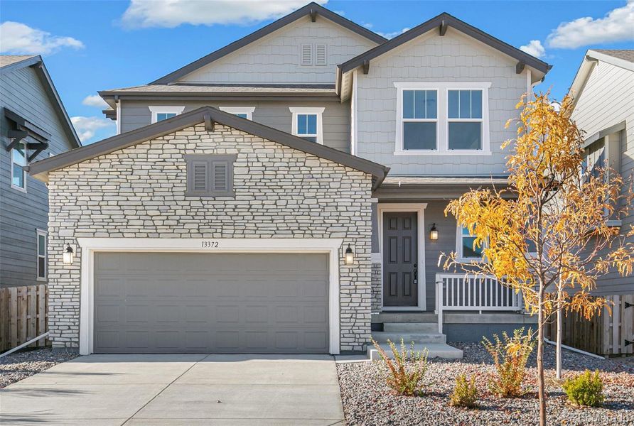 Front exterior of a new home in Turnberry, Commerce City, CO, highlighting curb appeal (Image 20). Front exterior of a new home in Turnberry, Commerce City, CO, highlighting curb appeal (Image 20).