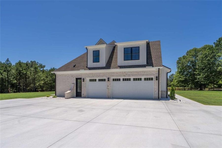 Front exterior of a new home in , Monroe, GA, highlighting curb appeal (Image 31).