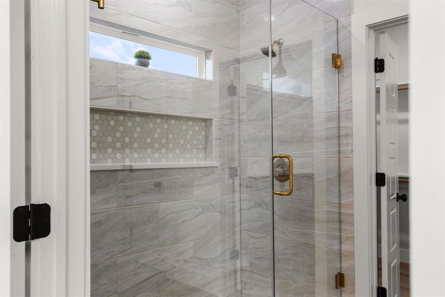 Bathroom featuring walk in shower