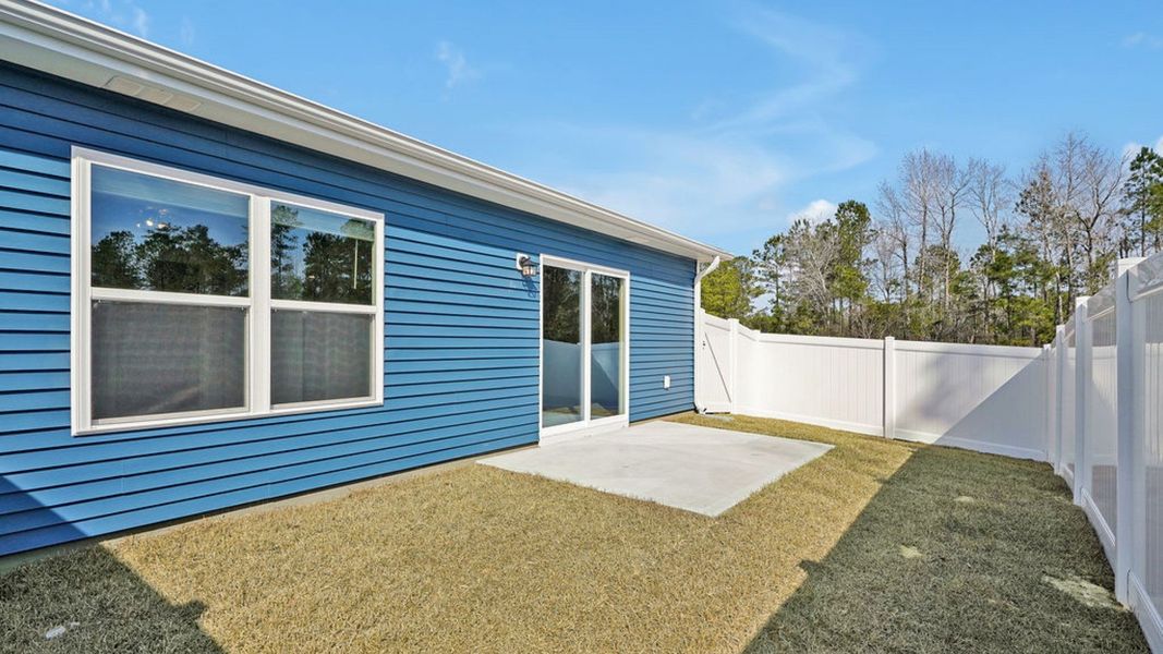 Representative exterior photo of a completed home built from the BAYSHORE by D.R. Horton in Indigo Preserve Townhomes, Leland, NC (Image 18).