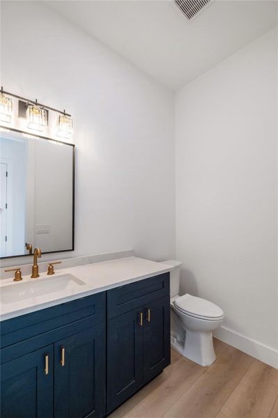 Bathroom featuring vanity and light wood-type flooring