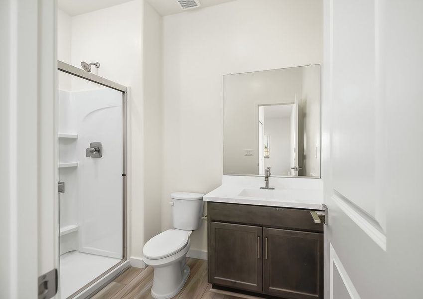 First-floor bathroom with cultured marble vanity and walk-in shower in Wellton floor plan