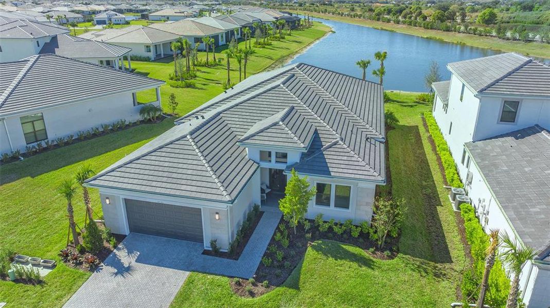 Front exterior of a new home in , Sarasota, FL, highlighting curb appeal (Image 30).