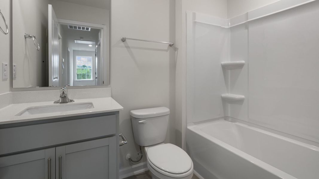 Furnished interior view inside a new home in The Grove at Matthews Landing, Fuquay Varina (Image 10).