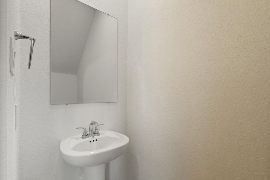 Powder bath located under the stairs. Powder bath located under the stairs.