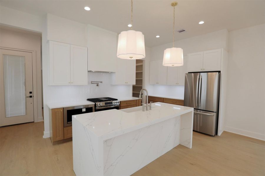 Fully equipped kitchen, enjoy ease of move-in with a featuring a dishwasher, refrigerator, gas range, and built-in microwave; ready to support you as you cook and entertain. Fully equipped kitchen, enjoy ease of move-in with a featuring a dishwasher, refrigerator, gas range, and built-in microwave; ready to support you as you cook and entertain.