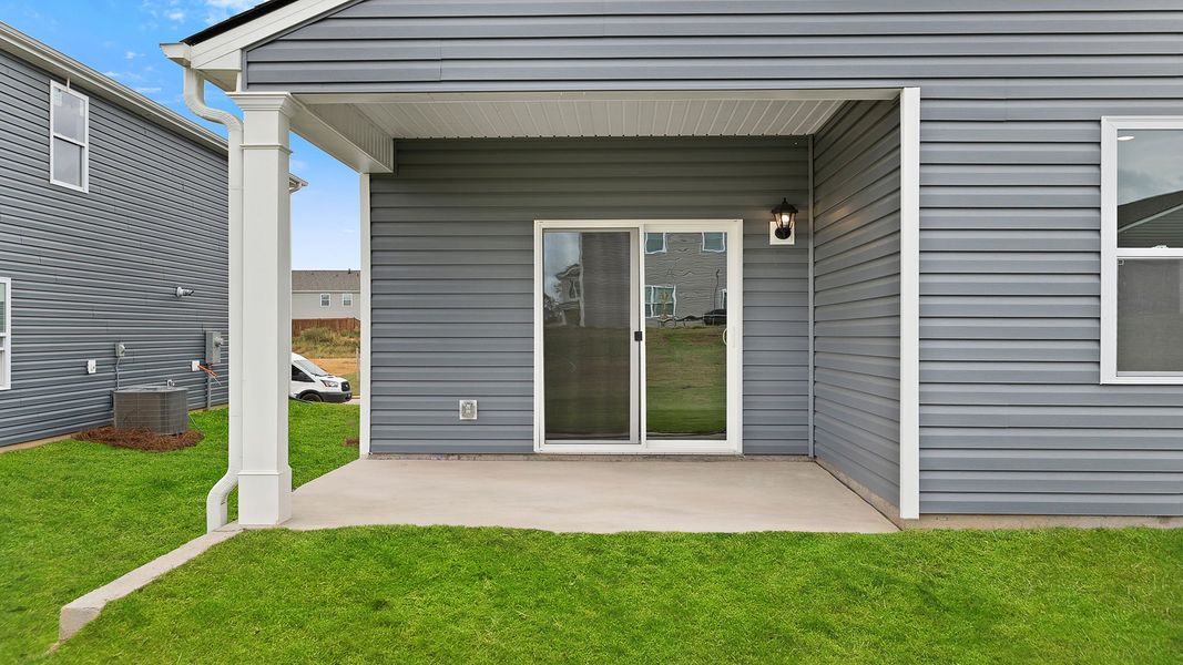 Exterior details and patio area of a home in Durbin Meadows Traditions, Fountain Inn (Image 3).