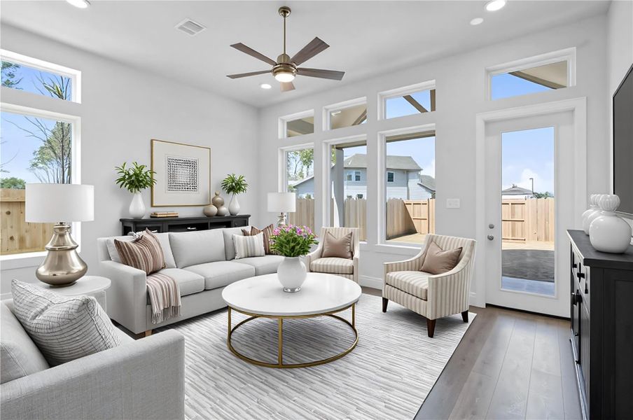 Soaring, tall windows frame the living space, bathing the room in natural light and highlighting the architectural volume of the space. A convenient back door provides direct and easy access to a comfortable covered patio, effortlessly extending your living space outdoors for year-round enjoyment and entertaining. *Virtually Staged Soaring, tall windows frame the living space, bathing the room in natural light and highlighting the architectural volume of the space. A convenient back door provides direct and easy access to a comfortable covered patio, effortlessly extending your living space outdoors for year-round enjoyment and entertaining. *Virtually Staged