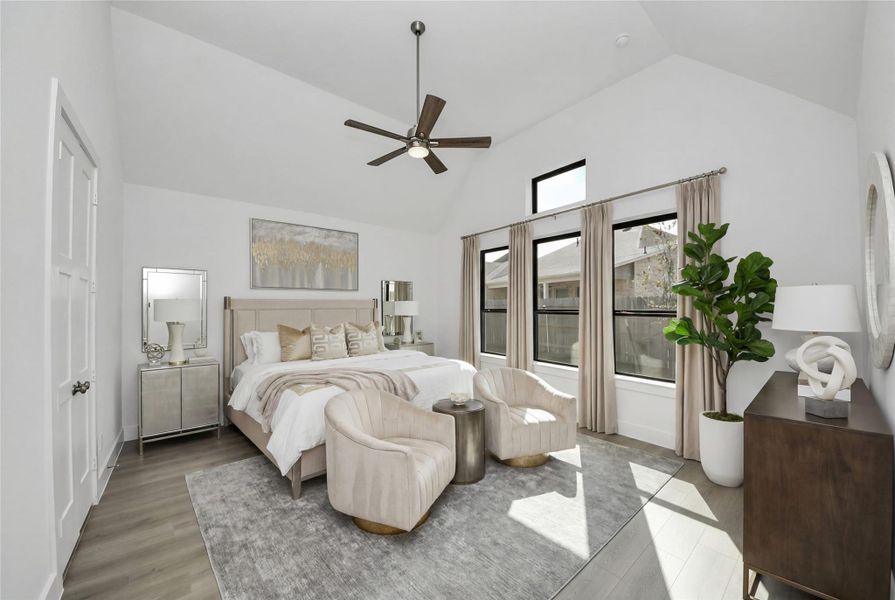Relax and unwind after a long day in this impressive primary suite! This generously sized room offers laminate flooring, neutral-toned paint, high ceilings with a ceiling fan, and large windows for added comfort and tranquility. Relax and unwind after a long day in this impressive primary suite! This generously sized room offers laminate flooring, neutral-toned paint, high ceilings with a ceiling fan, and large windows for added comfort and tranquility.