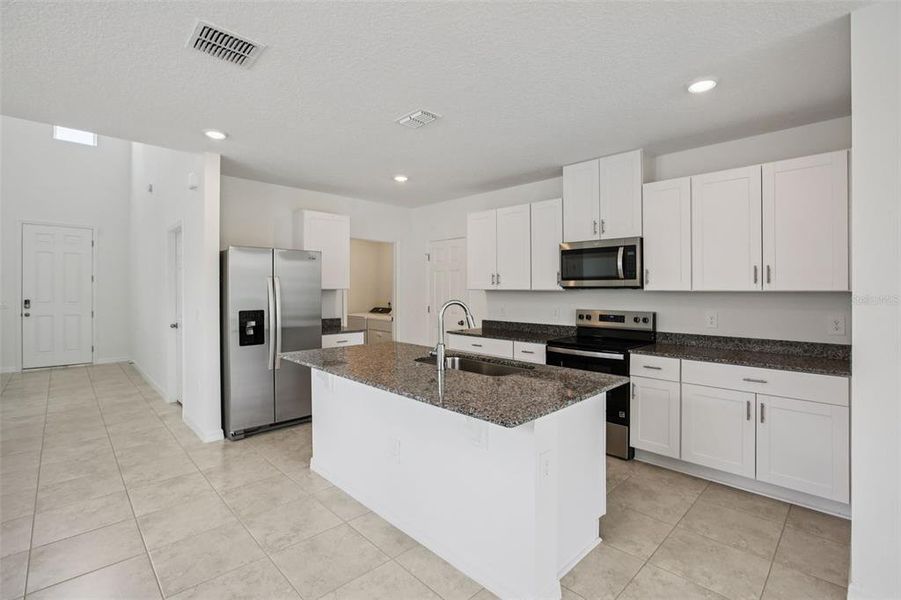 Furnished interior view inside a new home in Villamar - Classic Series, Winter Haven (Image 12).