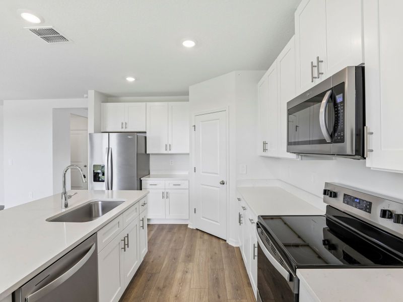 Furnished interior view inside a new home in Hilltop Vistas, Dade City (Image 5).