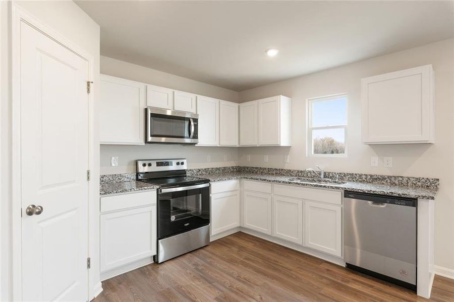 Furnished interior view inside a new home in Arrowhead By The Lake, Lizella (Image 9).