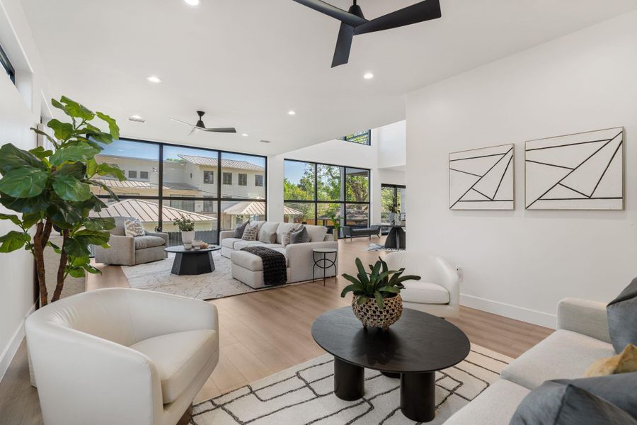 Floor to ceiling windows flood this expansive living space with ample natural light and its open floor plan lend to hosting friends and family for any occasion.