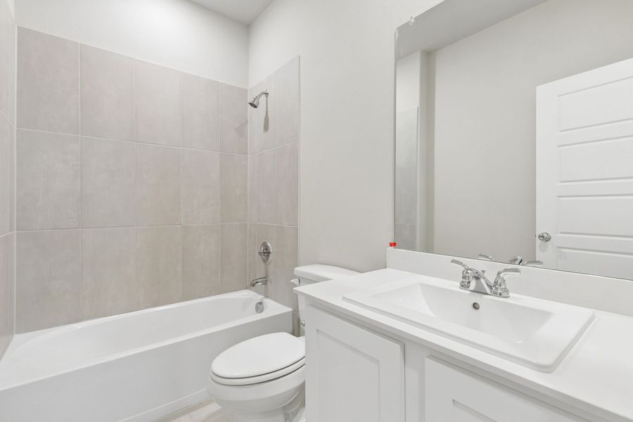 Bathroom in the Winters home plan by Trophy Signature Homes – REPRESENTATIVE PHOTO