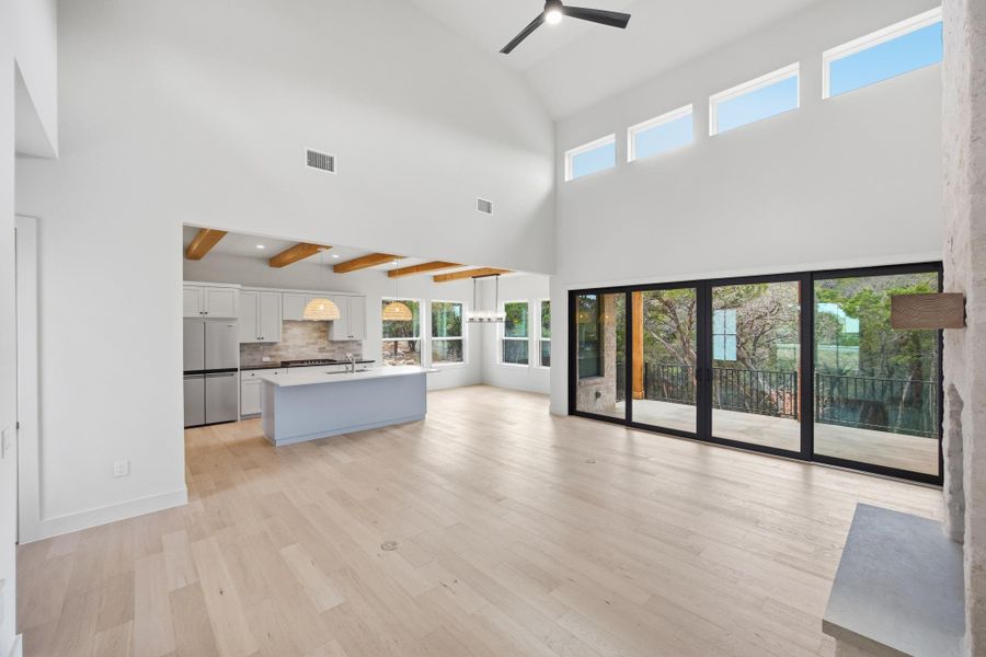 Light filled family room with clerestory windows opening to kitchen