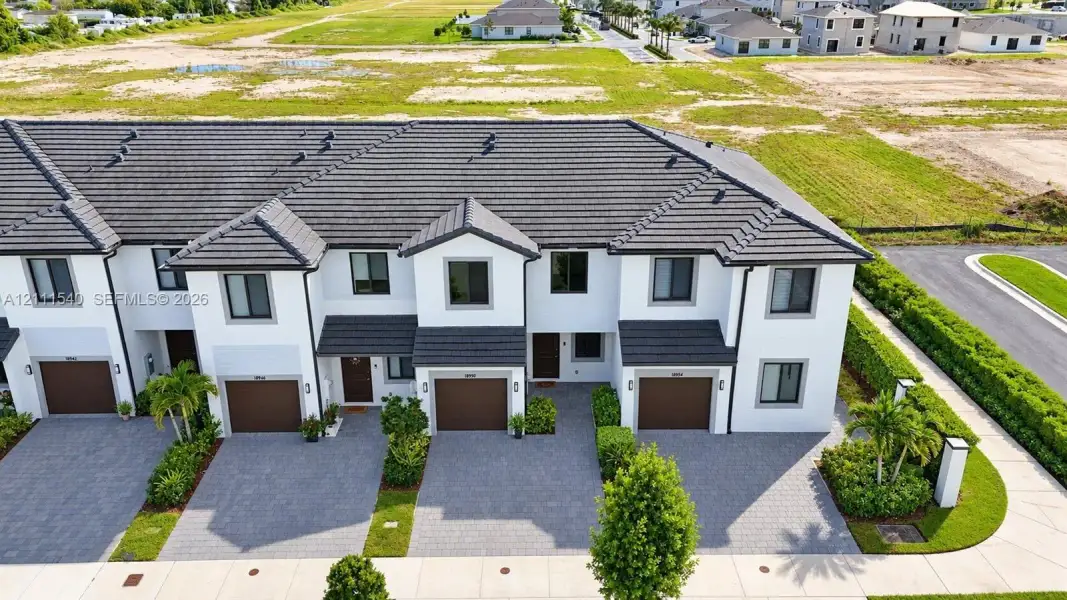 Front exterior of a new home in , Homestead, FL, highlighting curb appeal (Image 28).