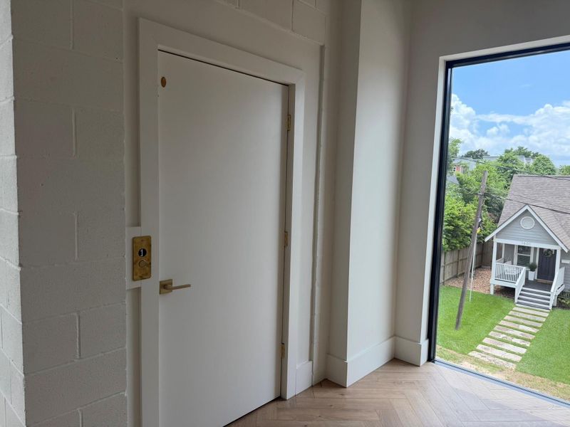 3 rd FLOOR ELEVATOR- which leads directly int o Primary Retreat. Light and Bright with LARGE windows to catch bright, blue sky's.