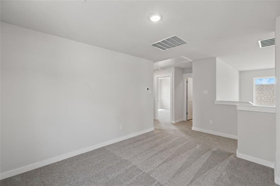 Unfurnished room featuring light carpet and recessed lighting