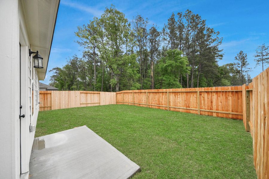 Exterior details and patio area of a home in The Enclave at Spring Branch, Montgomery (Image 4). Exterior details and patio area of a home in The Enclave at Spring Branch, Montgomery (Image 4).