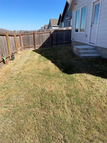 View of fenced backyard