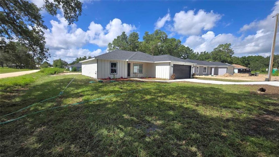 Front exterior of a new home in , Dunnellon, FL, highlighting curb appeal (Image 33).