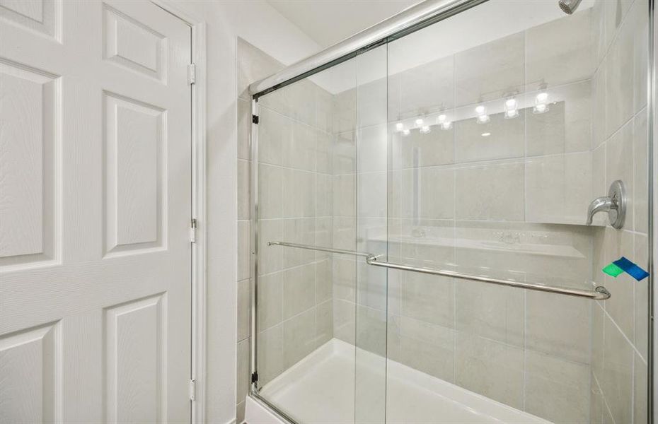 Owner's bath with oversized shower *real home pictured