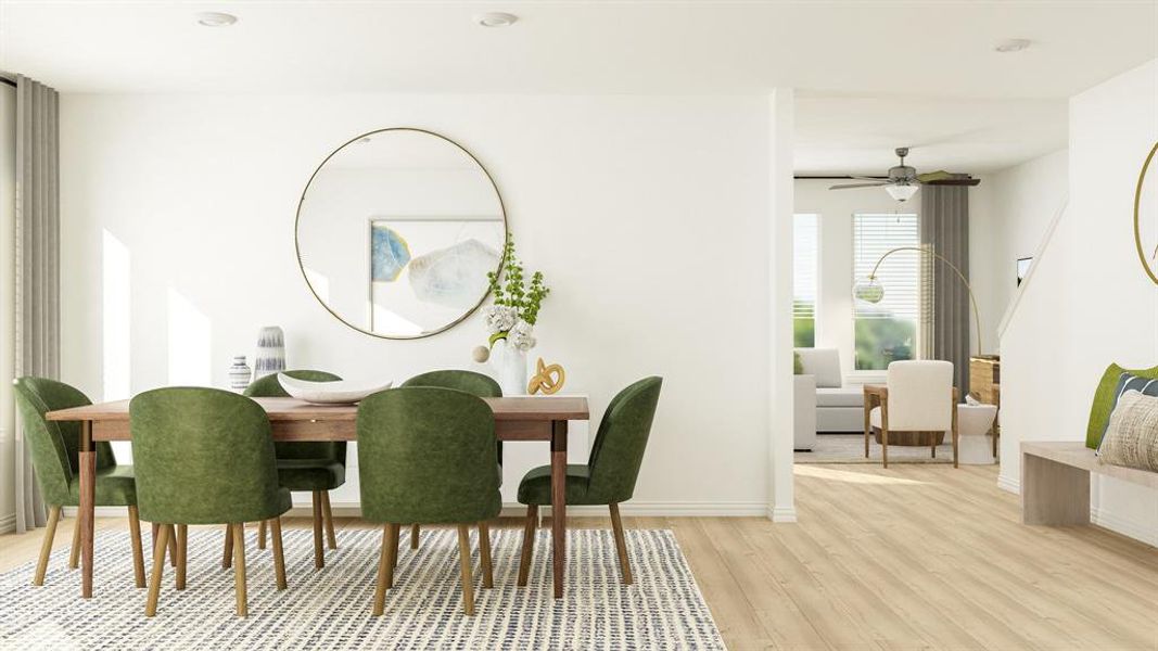 Dining room with light wood-type flooring and ceiling fan