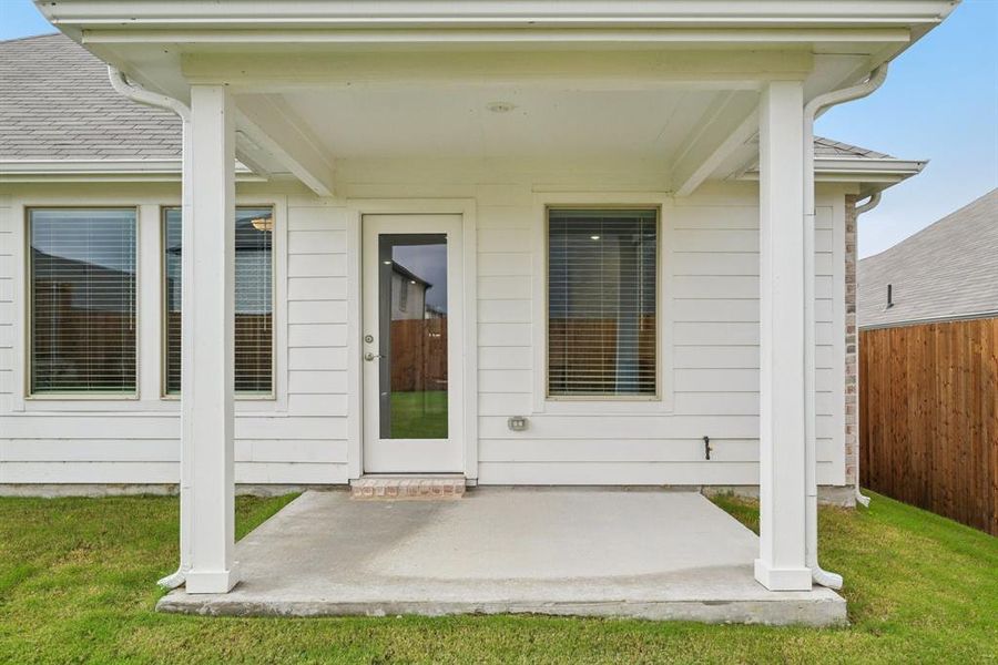Exterior details and patio area of a home in Simpson Crossing - Signature Series, McKinney (Image 3). Exterior details and patio area of a home in Simpson Crossing - Signature Series, McKinney (Image 3).