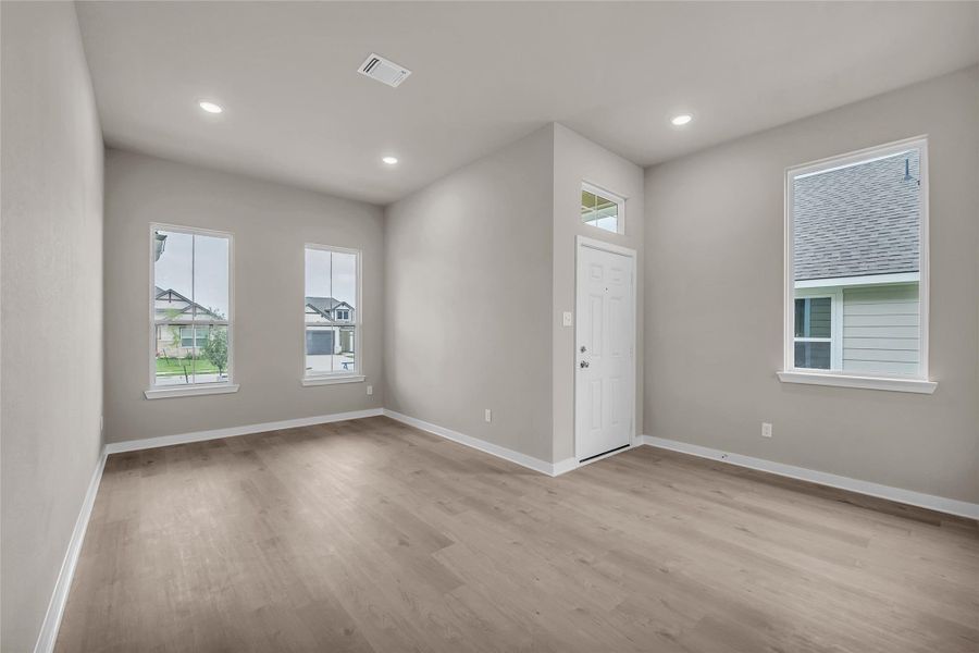 Spare room with light wood-type flooring and recessed lighting