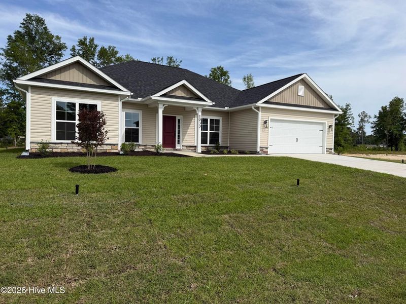 Front exterior of a new home in Wood Creek Landing, Leland, NC, highlighting curb appeal (Image 2). Front exterior of a new home in Wood Creek Landing, Leland, NC, highlighting curb appeal (Image 2).