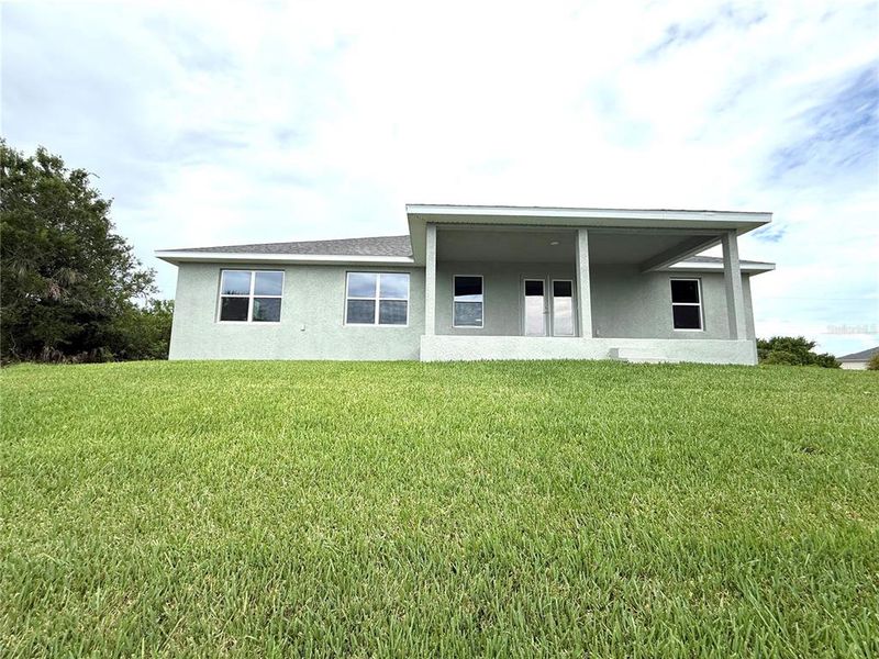 Front exterior of a new home in South Gulf Cove, Port Charlotte, FL, highlighting curb appeal (Image 2).