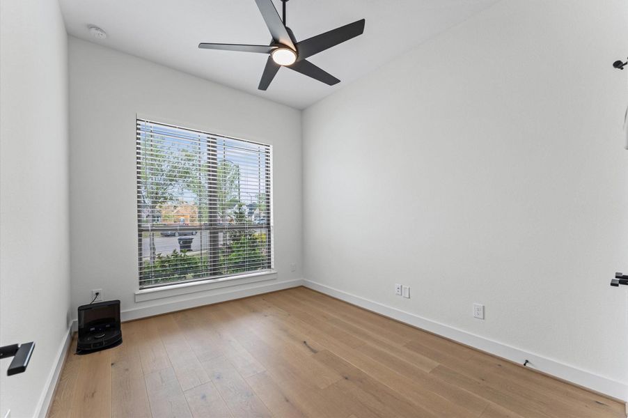 Natural light pours through this bedroom — a calm, comfortable space with generous square footage and a layout that just works.