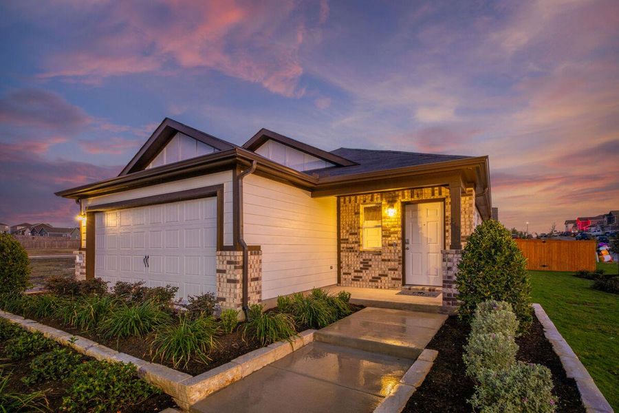 Front exterior of a new home in Cool Water, Jarrell, TX, highlighting curb appeal (Image 1). Front exterior of a new home in Cool Water, Jarrell, TX, highlighting curb appeal (Image 1).